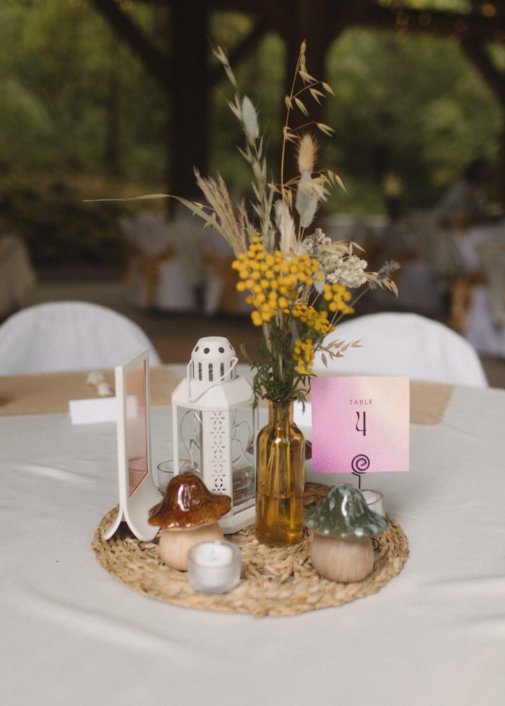 Table decor includes mushrooms and died flowers