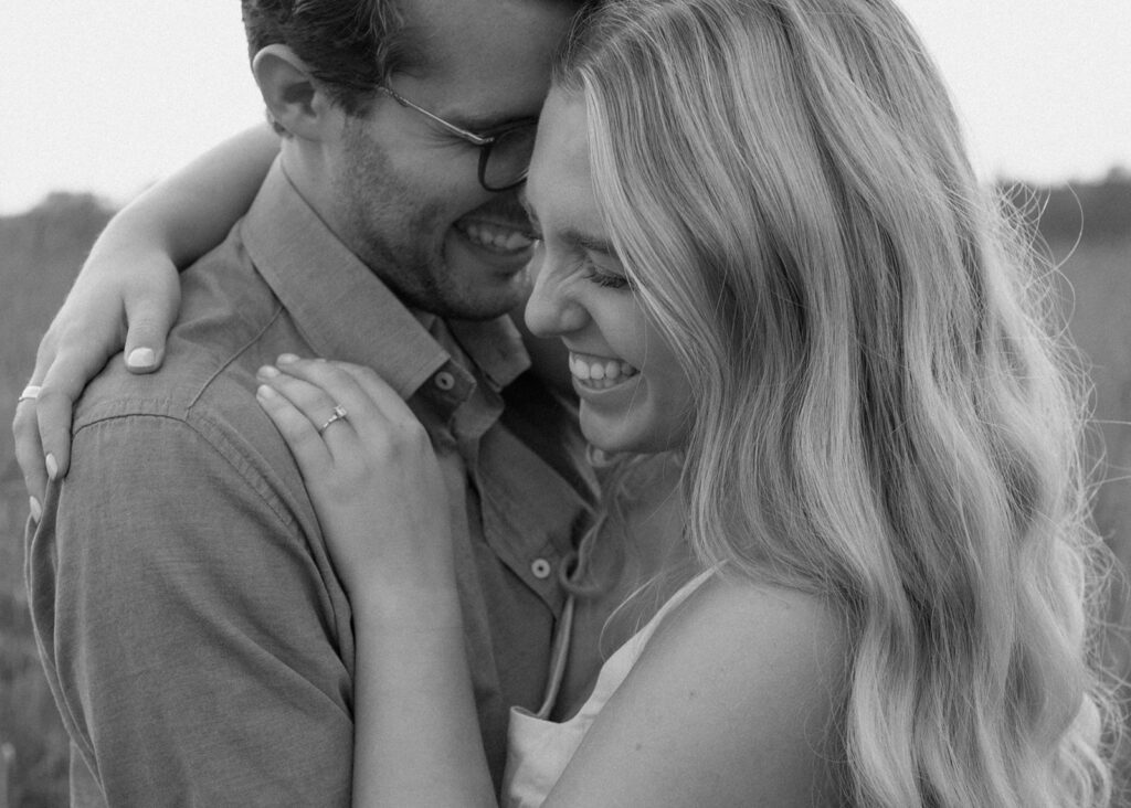 Couple embraces at blue hour engagement photos in Afton.