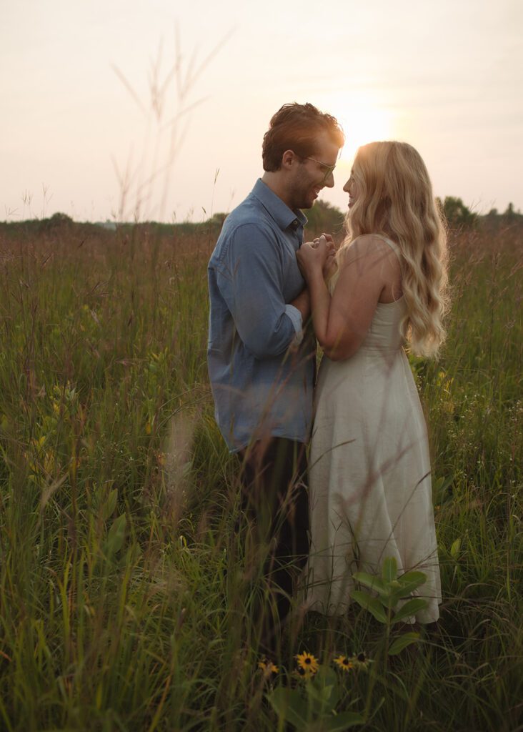 Couple embraces at blue hour engagement photos in Afton.