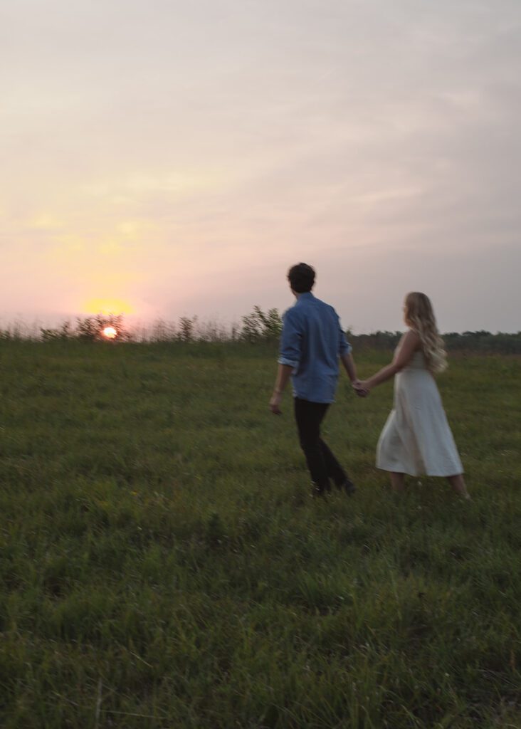 Couple walks at blue hour engagement photos in Afton.