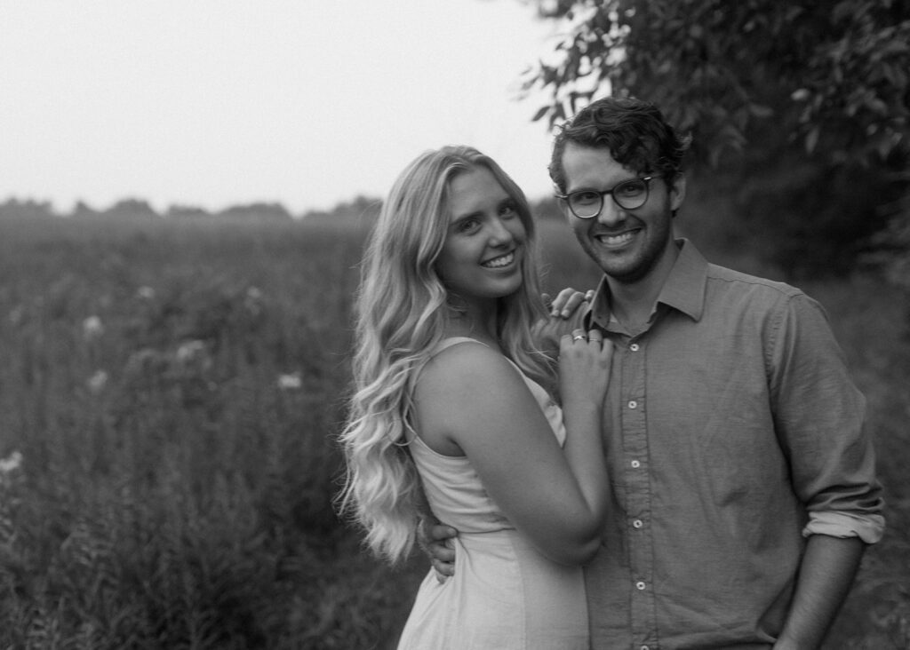 Couple embraces at blue hour engagement photos in Afton.