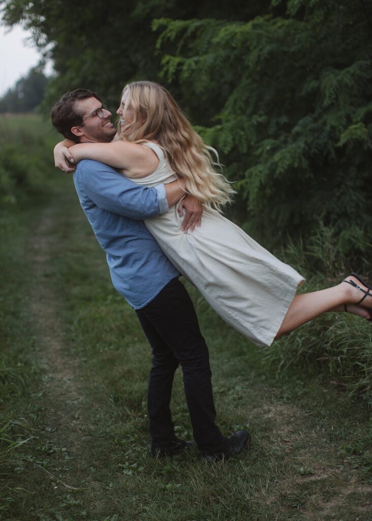 Couple embraces at blue hour engagement photos in Afton.